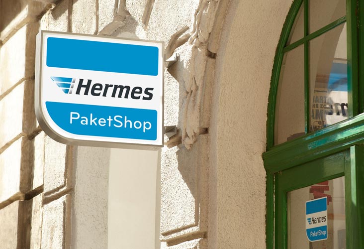Außenschild mit Hermes Logo vor Shop